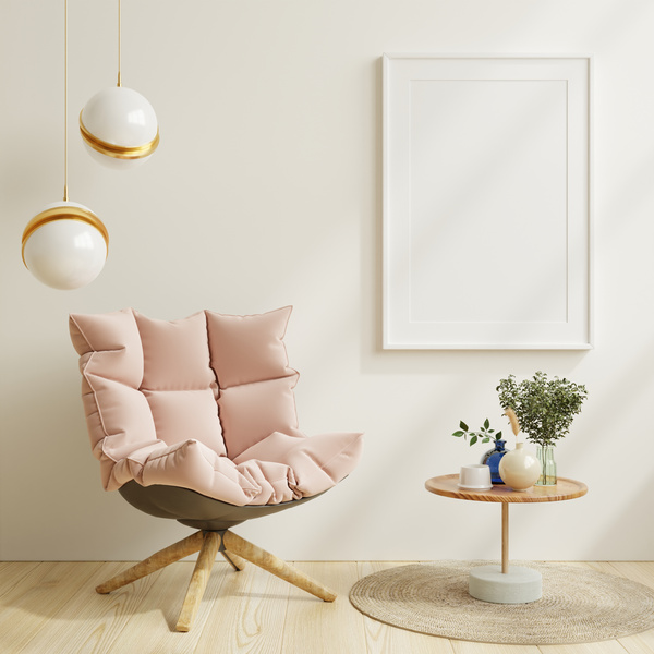 Pink Armchair With Blank Frame on Wall